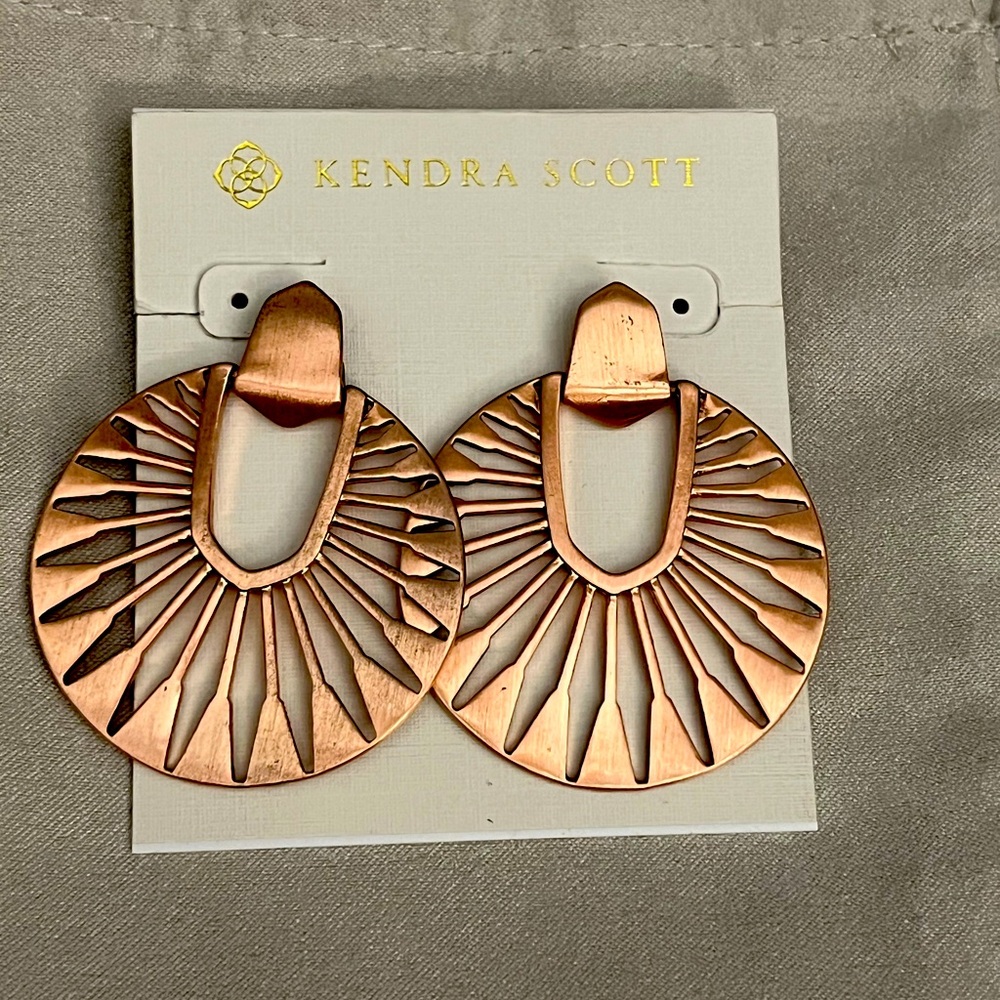 Kendra Scott Rose Gold Didi Sunburst earrings.
